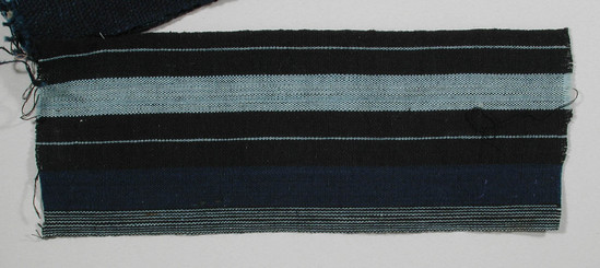 Hearst Museum object titled Textile fragment, accession number 5-11135, described as Textile sample (section of narrow band weaving): cotton; black; pale blue; and blue strips; two black stripes with a pale blue strip; one black stripe with nine pale blue strips.