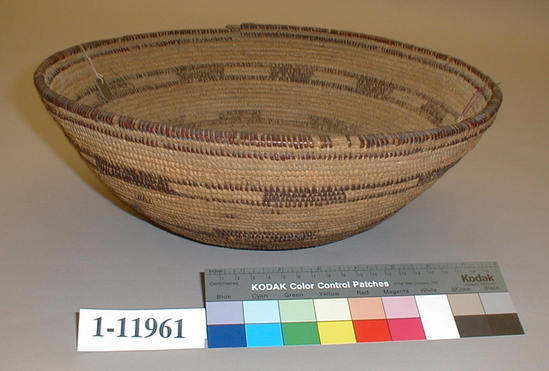 Hearst Museum object 1 of 2 titled Cooking basket, accession number 1-11961, described as Hemispherical coiled basket.  Tag "Yuki". Per Ralph Shanks:  Wide- mouthed coiled basket bowl, the same shape and size as a typical Yuki cooking bowl.  It has food residue in it but no evidence of cooking, it could have been used as a sifter.  The basket has a pinhole start.  The coil foundation is mixed rods and splints.  The wefts are peeled and unpeeled redbud.  The design is six horizontal bands with varying widths, a few with open and closed rectangles.    The rim is plain wrapped.  The coil ending is broken, but several herringbone stitches are left.  The weft fag ends are a mixture of clipped and concealed.  The weft moving ends are concealed.  The workface has a few split stitches; the back face has up to 80% split stitches.  The basket has an exterior workface, with a rightward work direction, and a primarily down to the right slant of weft twist.