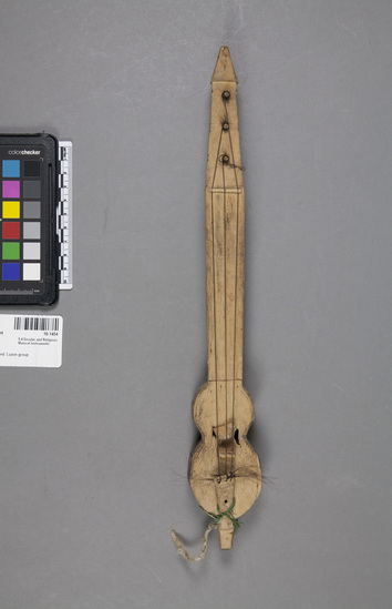 Hearst Museum object 4 of 4 titled Musical instrument, accession number 10-1454, described as Small 3-stringed violin; one pieced; incised decoration; 14 1/8” 1. Bow is 10-1759