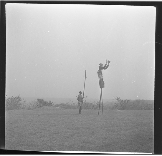 Hearst Museum object titled Black-and-white negative, accession number 15-31067, described as Black-and-white negative, Nigeria, Meko, Stilt dancer (Gagalo) (6), 1950-1951