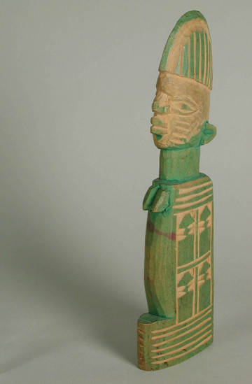 Hearst Museum object titled Doll, accession number 5-7265, described as wood doll;  carved and incised slab shaped doll, painted green.  21 cms height.