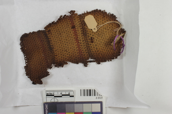 Hearst Museum object titled Cloth, accession number 2-3727, described as A small piece of cloth knitted in three colors.