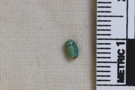 Hearst Museum object 6 of 6 titled Scarab, accession number 6-20630, described as tiny green scarab. New Empire