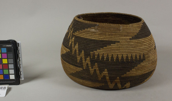 Hearst Museum object 3 of 3 titled Basket, accession number 1-211527, described as Coiled; globular. Decoration: black design known as "lightening and rain tree". 3-rod coiling with herringbone stitch at rim. Stitches are split on interior face.