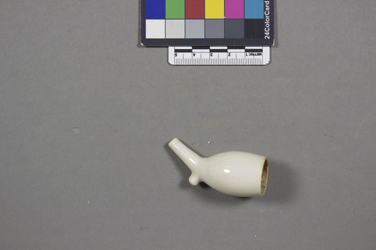 Hearst Museum object titled Smoking pipe, accession number 7-1294, described as Polished clay pipe bowl; metal stem.