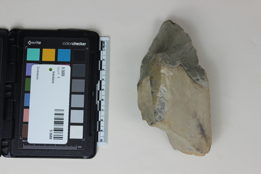 Hearst Museum object 1 of 2 titled Handaxe, accession number 5-3689, described as Crude hand-axe; banded grey-black flint; 13.5 x 6.9 cm.