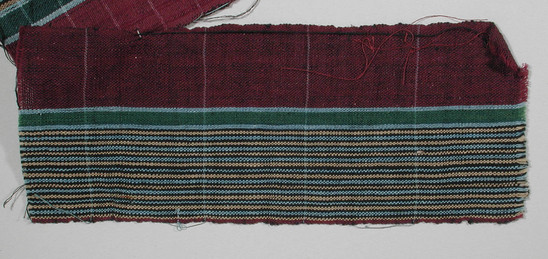 Hearst Museum object titled Textile fragment, accession number 5-11267, described as textile sample (section of narrow band weaving): left half rose, center narrow green and blue stripe, right half tan, pale blue, black alternating stripe.