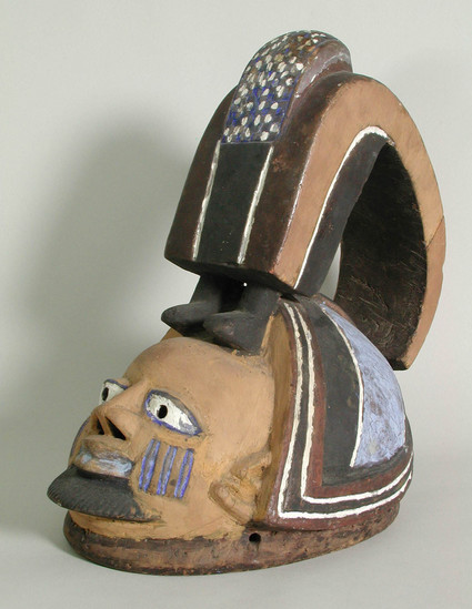 Hearst Museum object titled Mask, accession number 5-14941, described as anthropomorphic Gelede mask (Save, 2500) 1944, “Egungun”; One of a pair (see #48). yellow ground with white, purple and black. H = 36.3cm