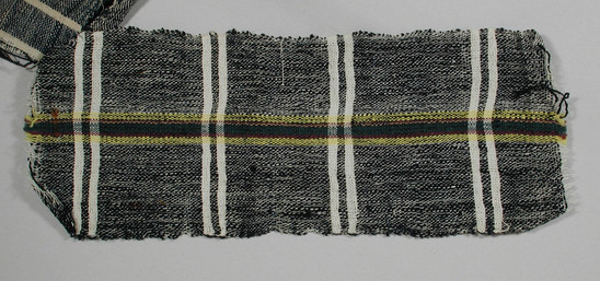 Hearst Museum object titled Textile fragment, accession number 5-11063, described as Textile sample (section of narrow band weaving): White waft with central stripe of yellow, green, maroon, and tan. Navy weft with narrow white stripes.