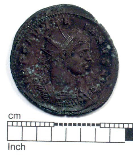 Hearst Museum object 1 of 8 titled Coin: billon antoninianus, accession number 8-4068, described as Coin; Billon; Antoninianus; Roman. 5.40 grams, 26 mm. Aurelian, 270-275 AD. Rome, Italy. Obverse: IMP C AVRELIANVS, Bust r. radiate. Reverse: ORIENS AVG, Sol l., between two captives, in exergue T M