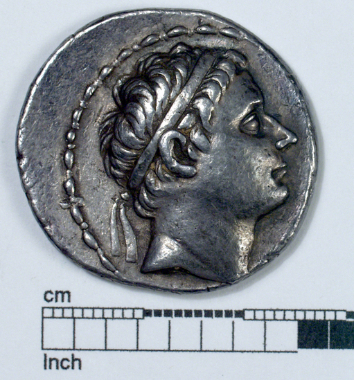 Hearst Museum object titled Coin: ar tetradrachm, accession number 8-4430, described as Coin; AR; Tetradrachm; 17.16 grams, 30 mm. Antiochus III, 223-208 BC. Apamea, Syria. Obverse: bust of Antiochus III r. diademed. Reverse: ΒΑΣΙΛΕΩΣ ANTIOXOY, Apollo seated l. holding bow; to l., monogram.