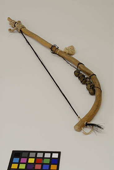 Hearst Museum object 2 of 4 titled Musical bow, accession number 9-10948, described as Bow for stringed musical instrument; wood, horsehair, metal bells; 50 cm. length