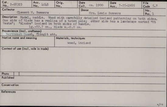 Documentation associated with Hearst Museum object titled Paddle, accession number 2-68323, described as Wood with carefully detailed incised patterning on both sides. One side of blade has a replica of a totem pole; other side has a landscape marked "Mt Vesta"; "Alaska" incised on both sides of handle.
