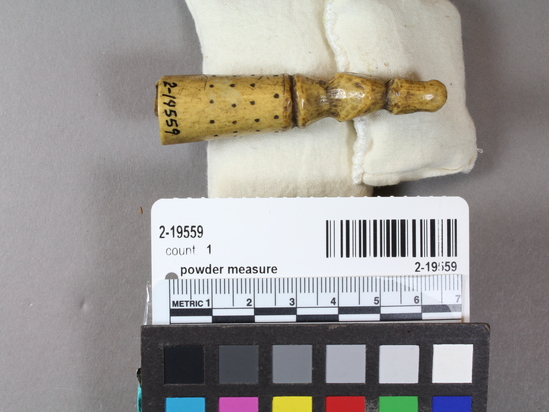 Hearst Museum object 9 of 12 titled Powder measure, accession number 2-19559, described as Carved ivory with human figure at top.