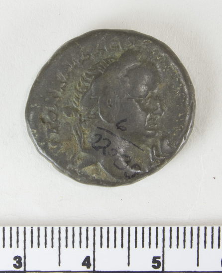 Hearst Museum object 6 of 6 titled Coin: billon tetradrachm, accession number 6-22589, described as obverse: head of Vespasian, right. laureate reverse: eirene standing left