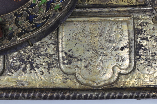 Hearst Museum object 34 of 49 titled Icon, accession number 7-3541, described as Icon of “Our lady of Vladmir”; Virgin and Child in tempera and gesso on wood; gilded silver basma; cloisonne halo with cloisonne collar pendant; halo has glass and amber (?) ornamentation; Virgin’s face damaged; height 30.2 cm, width 26 cm.