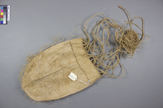 Hearst Museum object titled Fiber bag, accession number 11-42788, described as Bag, fiber, plaited; 20 cord handle, knotted at top; band of openwork around top of bag; untrimmed fiber on outside of bag. 27.0 cm. Used to carry personal belongings.