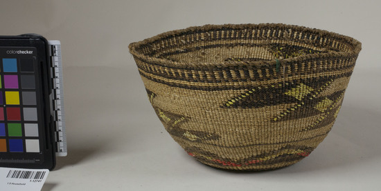 Hearst Museum object 2 of 2 titled Food basket, accession number 1-12741, described as Food basket; twined. Warp is twisted Tule (Schoenoplectus acutus), weft is twisted Tule. White pattern is Reed (Phragmites vulgaris). Red and black dyes are Tule root. Brown-black colors are mud-dyed split Tule. Yellow dye is Porcupine quills (Erethizon dorsatum) in lichen. Indigenous name: maksha. Same as 12739, with red porcupine quills in figure at bottom.