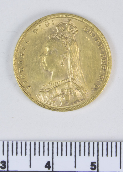 Hearst Museum object titled Coin: gold 2 pounds, accession number 7-3936, described as Coin, gold. 2 pounds.  Obverse: Head of Queen Victoria. Reverse: Saint George slaying the dragon; 1887.