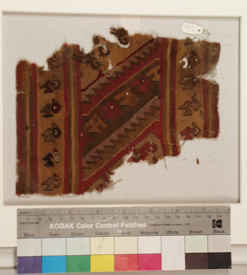 Hearst Museum object titled Tapestry fragment, accession number 16-980, described as Fragment of heavy finely woven tapestry decorated with bird and step design