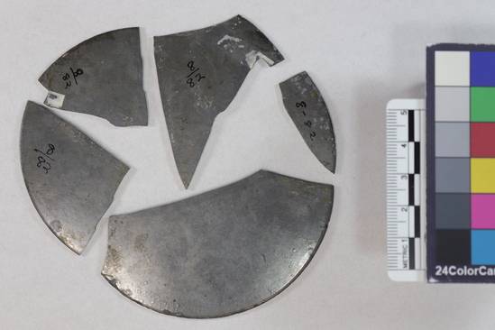 Hearst Museum object 3 of 6 titled Mirror fragments, accession number 8-82, described as Mirror fragments; mostly tin; incised lip, 3 1/2’’