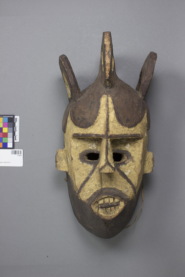 Hearst Museum object titled Mask, accession number 5-3419, described as Ibo Mask (Udi, 2, 500, 1945).  Open curls; medium size; black, white, and red.