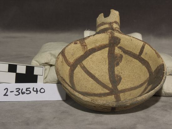 Hearst Museum object titled Ladle, accession number 2-36540, described as Ladle; grey-ware. Interior and exterior line design in brown on buff. Handle missing. 4 1/4 inch diameter, 2 inch height.