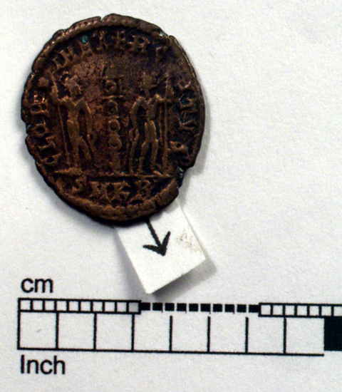 Hearst Museum object 3 of 8 titled Coin: æ, accession number 8-8610, described as Coin; bronze; obverse: head of Constantine I; reverse: standard between soldiers.