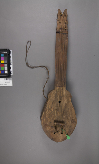 Hearst Museum object titled Musical instrument, accession number 10-1458, described as Medium small guitar; 6 strings; 22 1/2” 1.