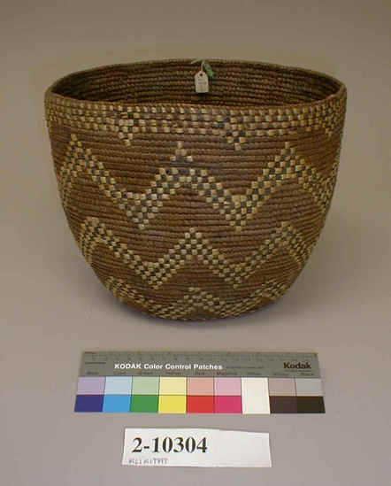 Hearst Museum object titled Bowl basket, accession number 2-10304, described as Deep, coiled basketry bowl, slightly oval in shape. Decoration in black and straw color zigzag lines in 3 encircling bands.