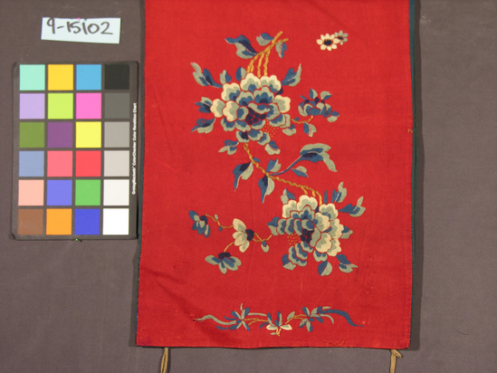 Hearst Museum object titled Lined piece, accession number 9-15102, described as Lined piece.  Wool, silk, metal wrapped yarns, cotton lining.  Fulled plain weave, embroidered, plain weave lining.  Red ground, varicolored embroidery, blue lining.  Floral motives.  17¼ inches by 57½ inches.