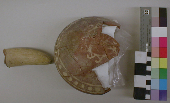 Hearst Museum object titled Bowl with handle, accession number 4-2709, described as Narrow-mouthed bowl, ladle-like, with straight handle, dark red with design in white.