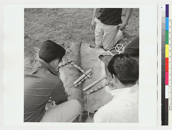 Hearst Museum object titled Black-and-white negative, accession number 15-19487, described as Indian boys and Sidney Parrish playing stick game