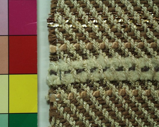 Hearst Museum object titled Textile sample, accession number 2-63796, described as Handwoven twill textile sample of cotton, metal and synthetic materials, with weft stripes.  Beige, white, gold and copper in color.