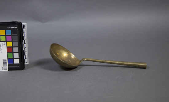 Hearst Museum object titled Ladle or spoon, accession number 9-765, described as Crude brass spoon; ladle; bowl diameter 9.6 cm; length 24.8 cm