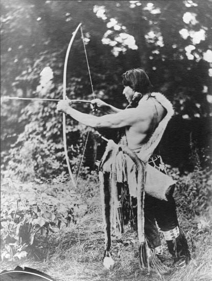 Hearst Museum object titled Photograph, accession number 13-94, described as Omaha man drawing bow and wearing traditional costume.