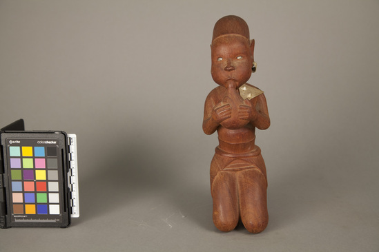 Hearst Museum object titled Figure, accession number 5-14098, described as Figure, wood, carved, female; aluminum necklace and earrings; brown. Carved hardwood. 26.0 cm.