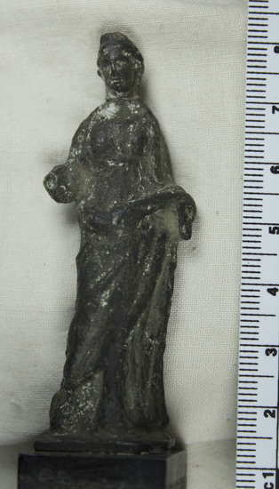 Hearst Museum object titled Female figurine, accession number 8-4599, described as Small bronze female figure; right forearm missing