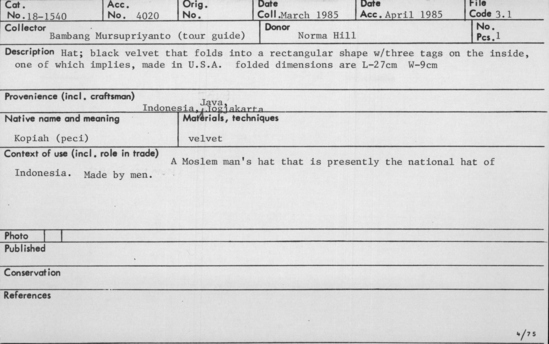 Documentation associated with Hearst Museum object titled Hat, accession number 18-1540, described as Hat; black velvet that folds into a rectangular shape with three tags on the inside, one of which implies, made in U.S.A. A Moslem manâs hat that is presently the national hat of Indonesia. Made by men. Folded dimensions are length 27 cm and width 9 cm.