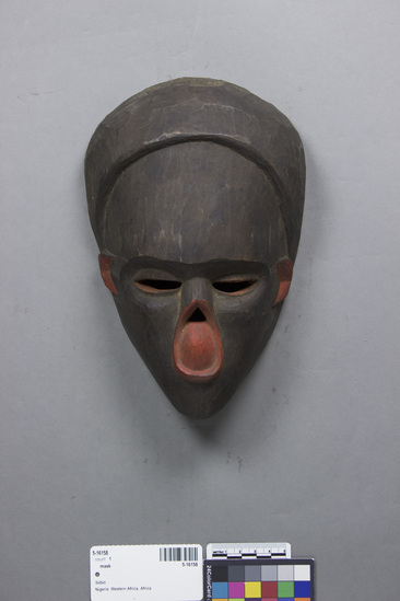 Hearst Museum object titled Mask, accession number 5-16158, described as Ibibio leper mask with nose eaten away; carved and painted black and red