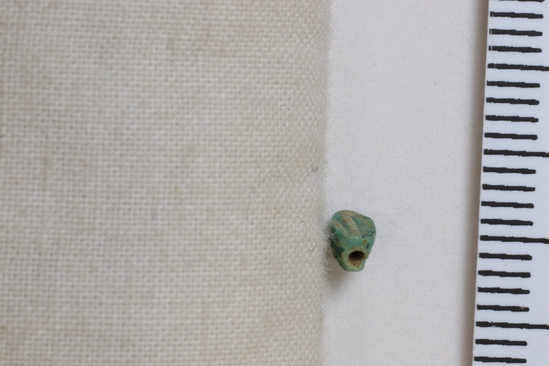 Hearst Museum object 5 of 6 titled Scarab, accession number 6-20630, described as tiny green scarab. New Empire