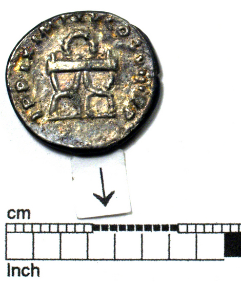 Hearst Museum object 6 of 8 titled Coin: æ denarius, accession number 8-5928, described as Coin: Denarius; (AR?) Æ; Titus - 2.56 grams. Rome, 80 AD. Obverse: IMP TITVS CAES VESPASIAN AVG PM - head laureate facing right. Reverse: TRP IX IMP XV COS JIII [line over the III] PP - Curule chair above which is a wreath.