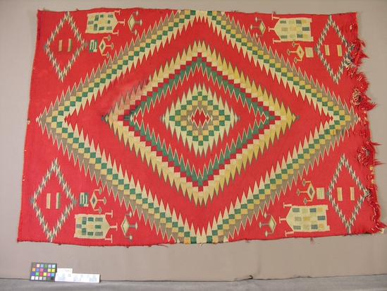 Hearst Museum object titled Blanket, accession number 2-17081, described as Germantown yarn blanket; red ground with varicolored designs including houses, outlined zigzags, terraces.