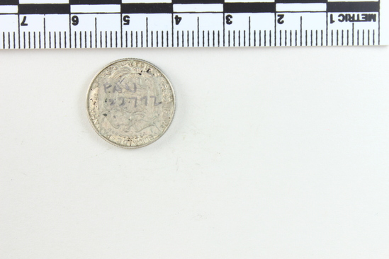 Hearst Museum object 5 of 6 titled Coin: silver 1 decimo, accession number 3-22772, described as Coin; Ag Un Decimo. Obverse: Bust of Balboa. Reverse: Crest of Republic of Panama; 1932. Panama Republic.