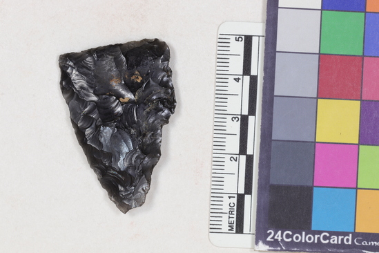 Hearst Museum object 1 of 2 titled Projectile point fragment, accession number 16-14295, described as Projectile point; obsidian; triangular; weight: 6.82 grams; length: 4.27 cm; width: 2.89 cm; depth: 0.66 cm; convex sides; straight, thinned base.