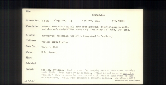 Documentation associated with Hearst Museum object titled Sash, accession number 7-5123, described as Woman's wool sash (pojas) made from homespun; brownish-purple; white and blue weft designs near ends; very long fringe; 5" wide, 142" long. Used by women for everyday wear as sash under prepaska sash, 7-5124. Worn alone by older women. Fringe at end known as amajlija, "amulet". Made by women for own use and still worn by some women at time of collection. 7-5119-5128 comprise a complete costume.