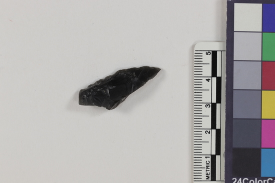 Hearst Museum object 2 of 2 titled Flake, accession number 16-14417, described as Projectile point fragment; obsidian; triangular; weight: 2.33 grams; length: 3.45 cm; width: 1.3 cm; depth: 0.64 cm.