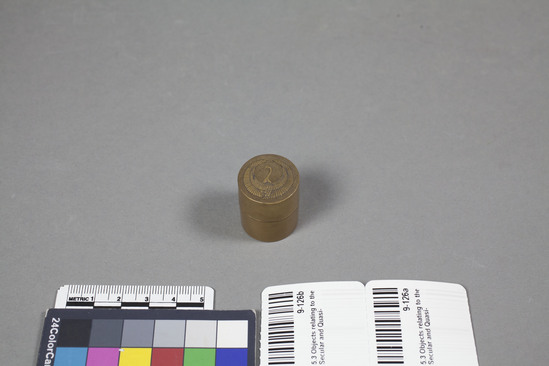 Hearst Museum object 2 of 2 titled Box and lid, accession number 9-126a,b, described as Cylindrical gilt wooden box, 1-1/16 inches high, 7/8 inch diameter. Crane on cover b) Probably for Incense Ceremony