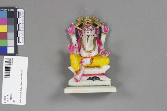 Hearst Museum object titled Figurine, accession number 9-11015, described as Religious figuring, in shape of god Ganesha; marble, painted; 12 cm length; 8 cm width