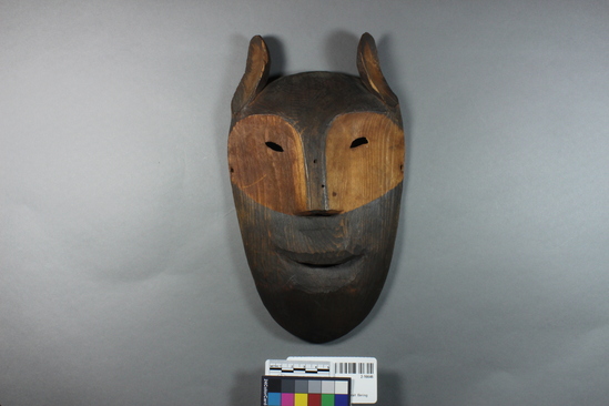 Hearst Museum object titled Mask, accession number 2-16646, described as Wooden; zoomorphic; painted black, except for area around eyes and nose, and inside of ears; commercial string tie.